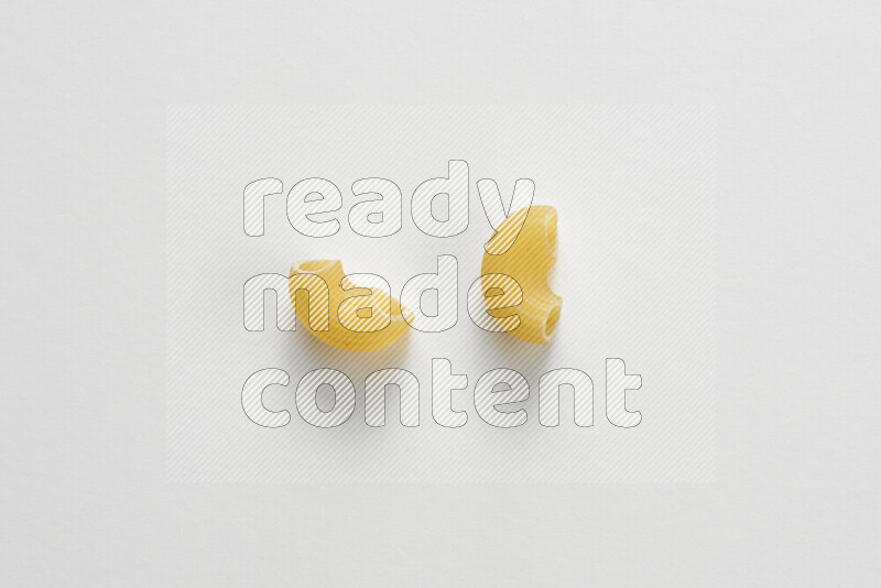 Elbow pasta on white background