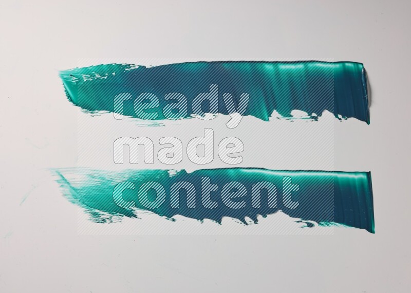 Turquoise painting knife strokes on white background