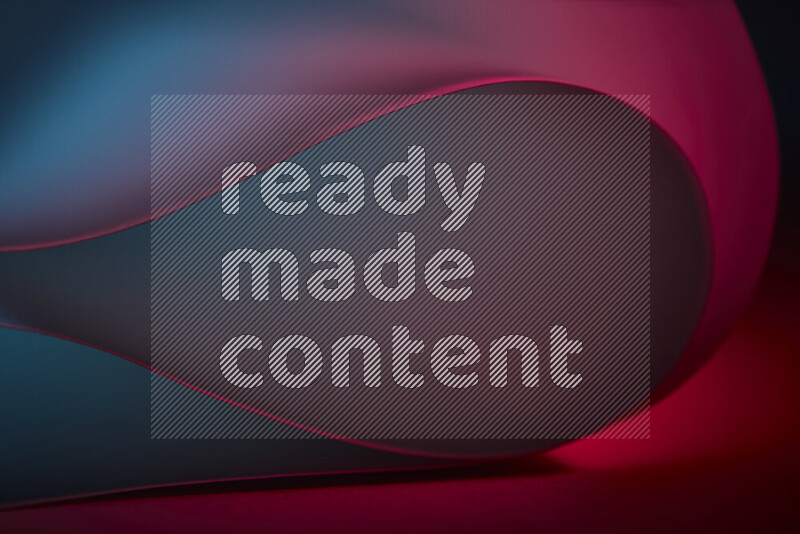 An abstract art piece displaying smooth curves in blue and red gradients created by colored light