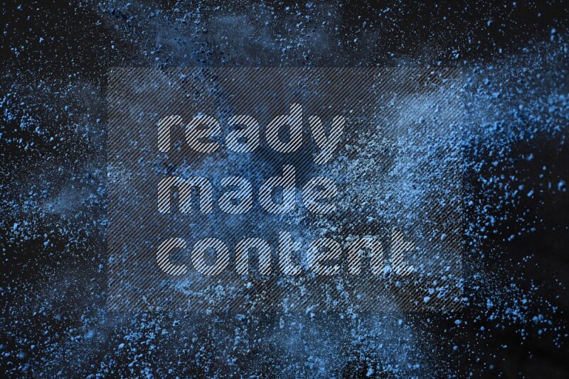 Blue powder explosion on black background