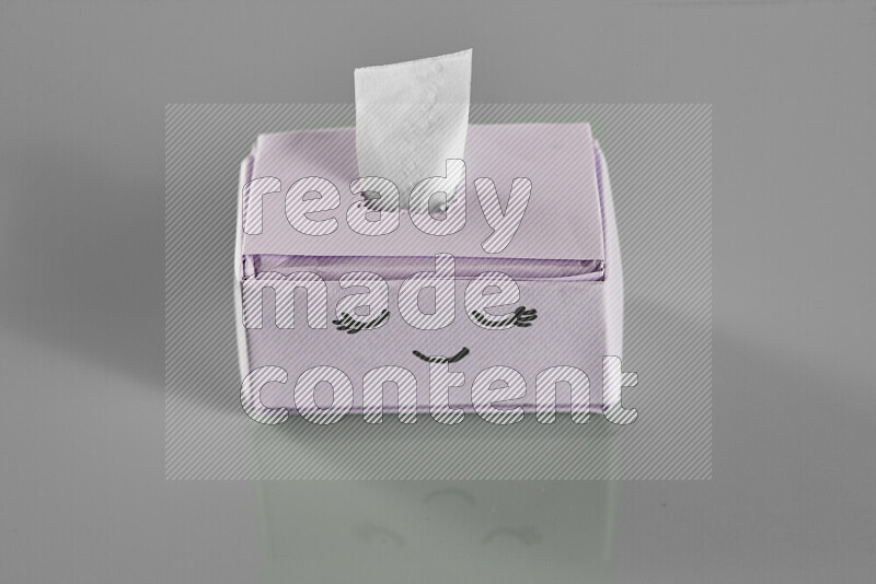 Origami tissue box on grey background