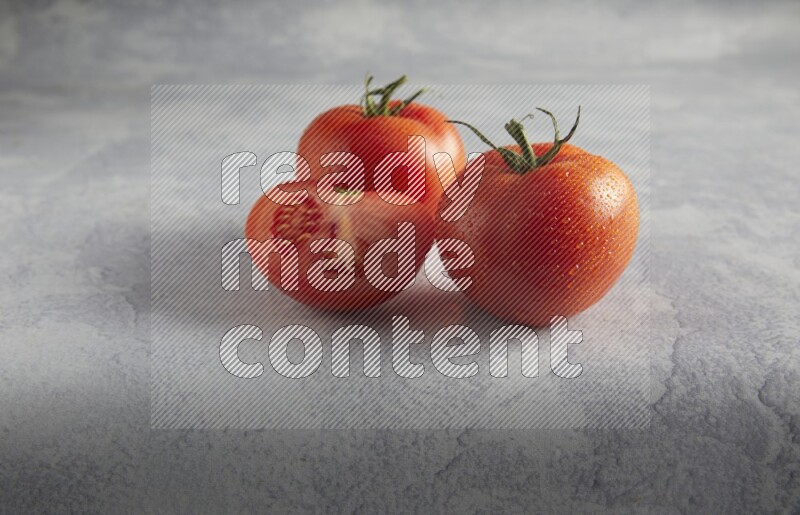 45 degree roma tomato on a textured light blue background
