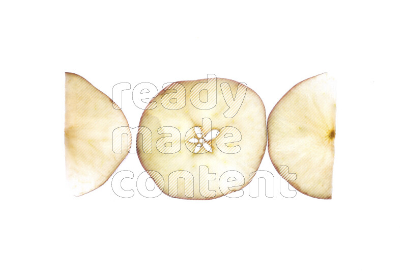 شرائح من التفاح علي خلفية بيضاء مضيئة