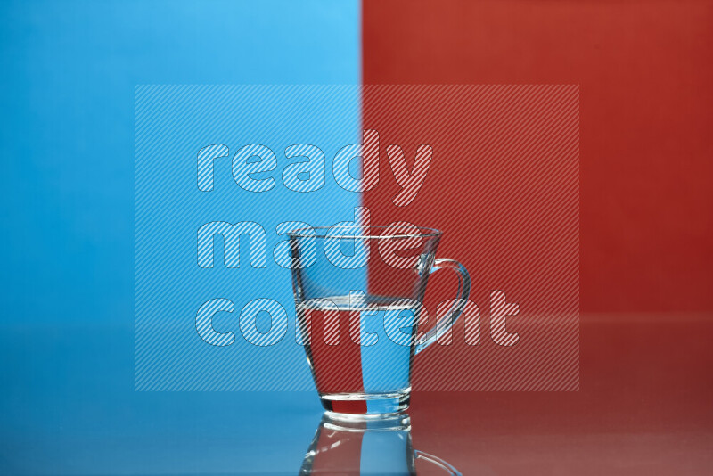 The image features a clear glassware filled with water, set against blue and red background