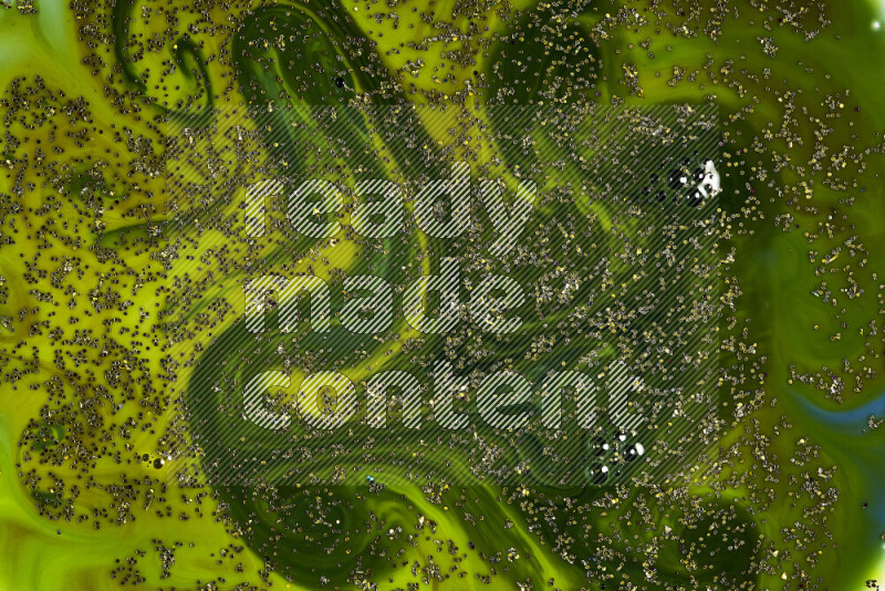 A close-up of sparkling gold glitter scattered on swirling green background