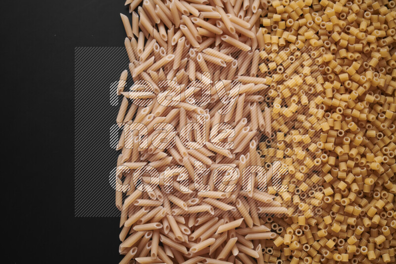 Different pasta types on black background