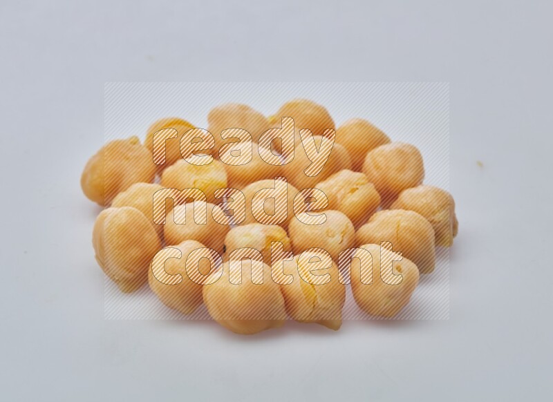 Close up shot of boiled chickpeas on white background