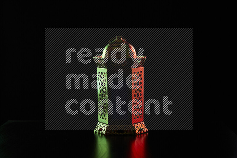 Ramadan lanterns with colored rim light against black background