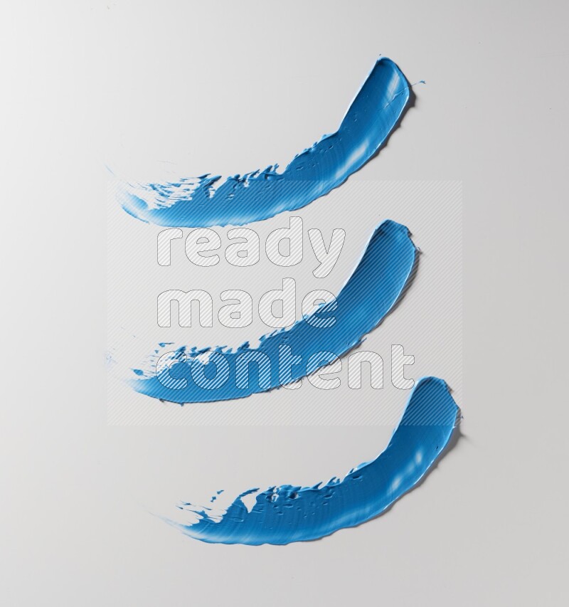 Blue painting knife strokes on white background