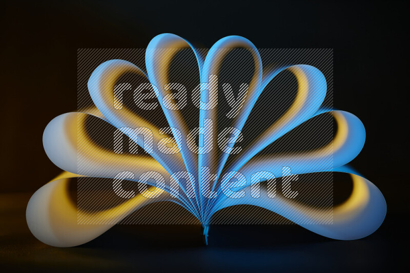 An abstract art piece displaying smooth curves in yellow and blue gradients created by colored light