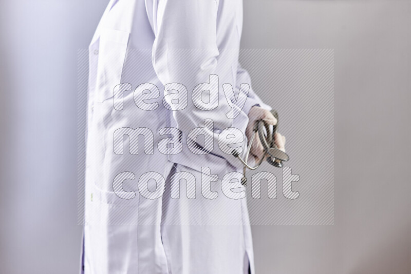 Female doctor wearing an abaya and medical attire in different positions