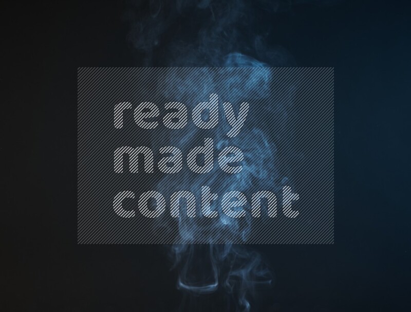 Heavy smoke in blue isolated on black background