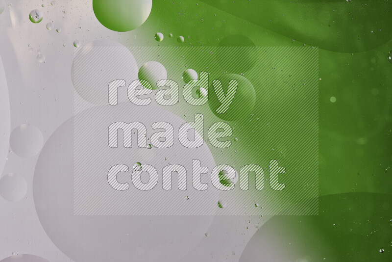 Close-ups of abstract oil bubbles on water surface in shades of white and green