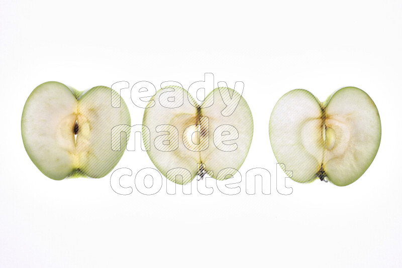Apple slices on illuminated white background