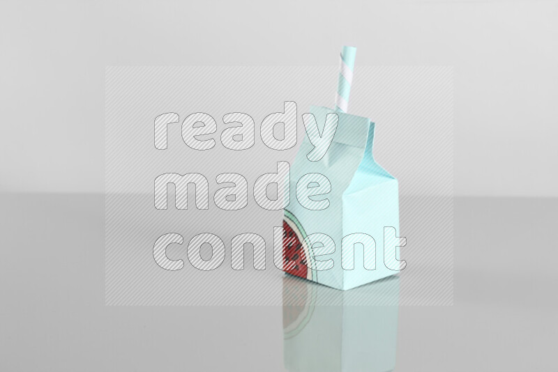 Origami juice box on grey background