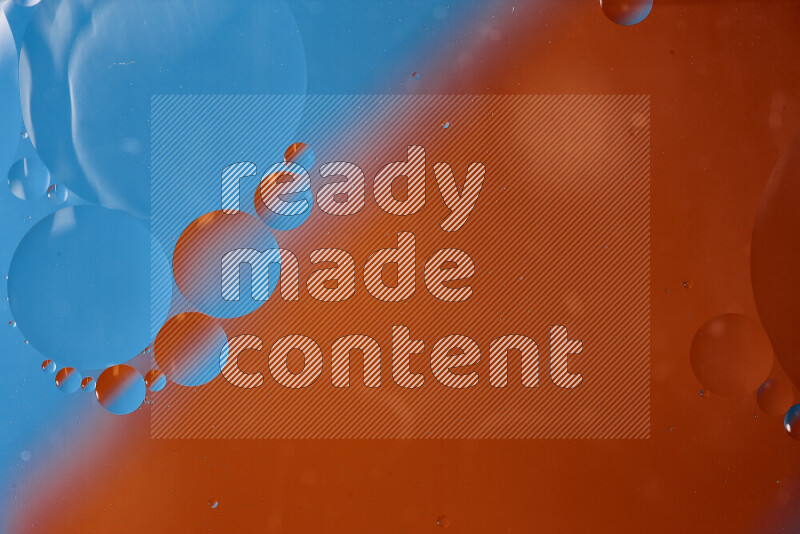 Close-ups of abstract oil bubbles on water surface in shades of blue and orange