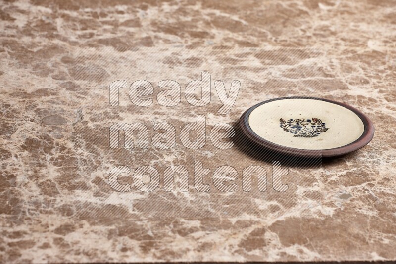 Decorative Pottery Plate on Beige Marble Flooring