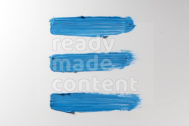 Blue painting brush strokes on white background
