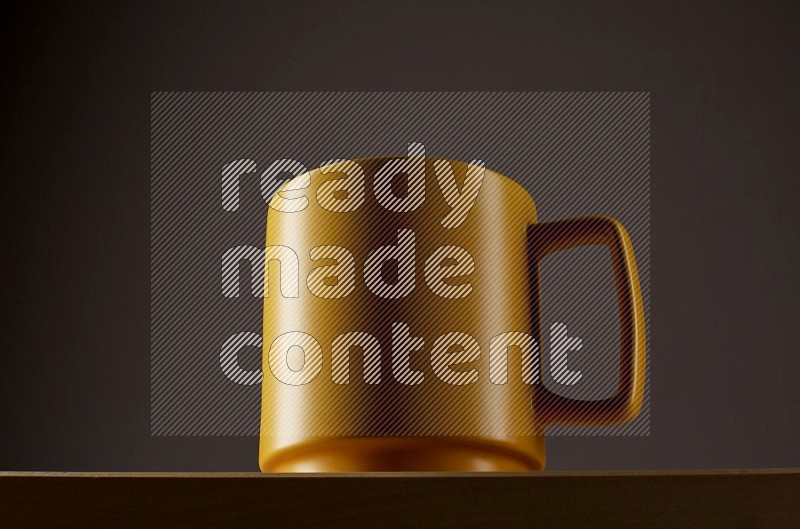 Low angle shot of a yellow cup on grey background