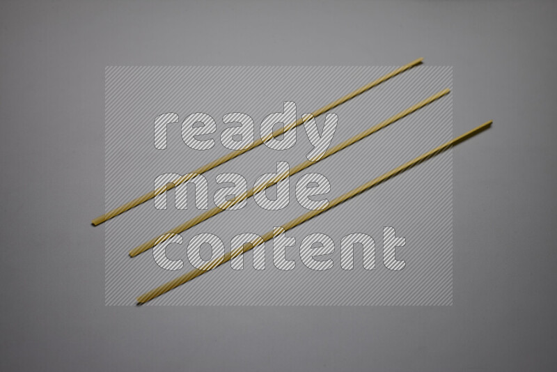 Linguini pasta on grey background