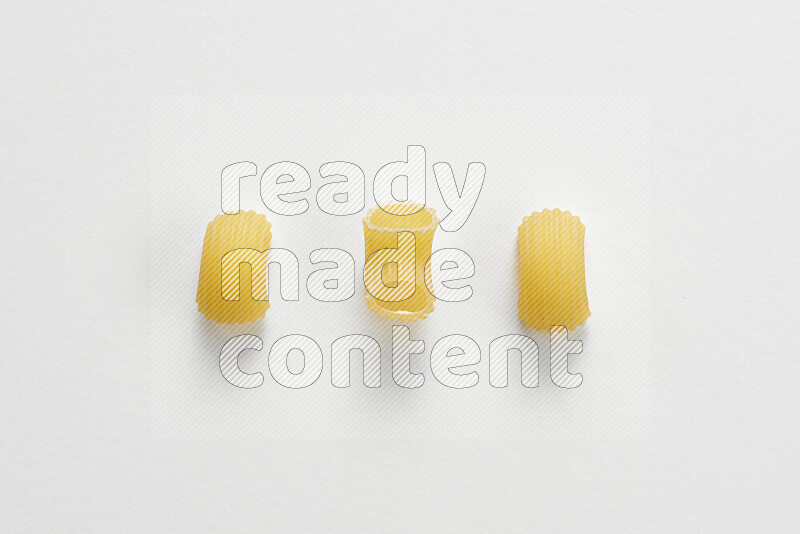 Elbow pasta on white background