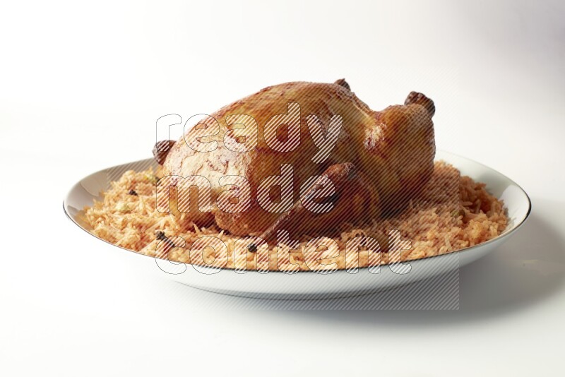 red basmati Rice with whole roasted chicken on a white plate with a silver rim direct on white background