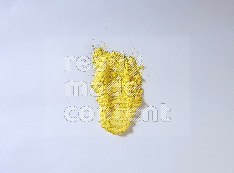 Yellow powder strokes on white background