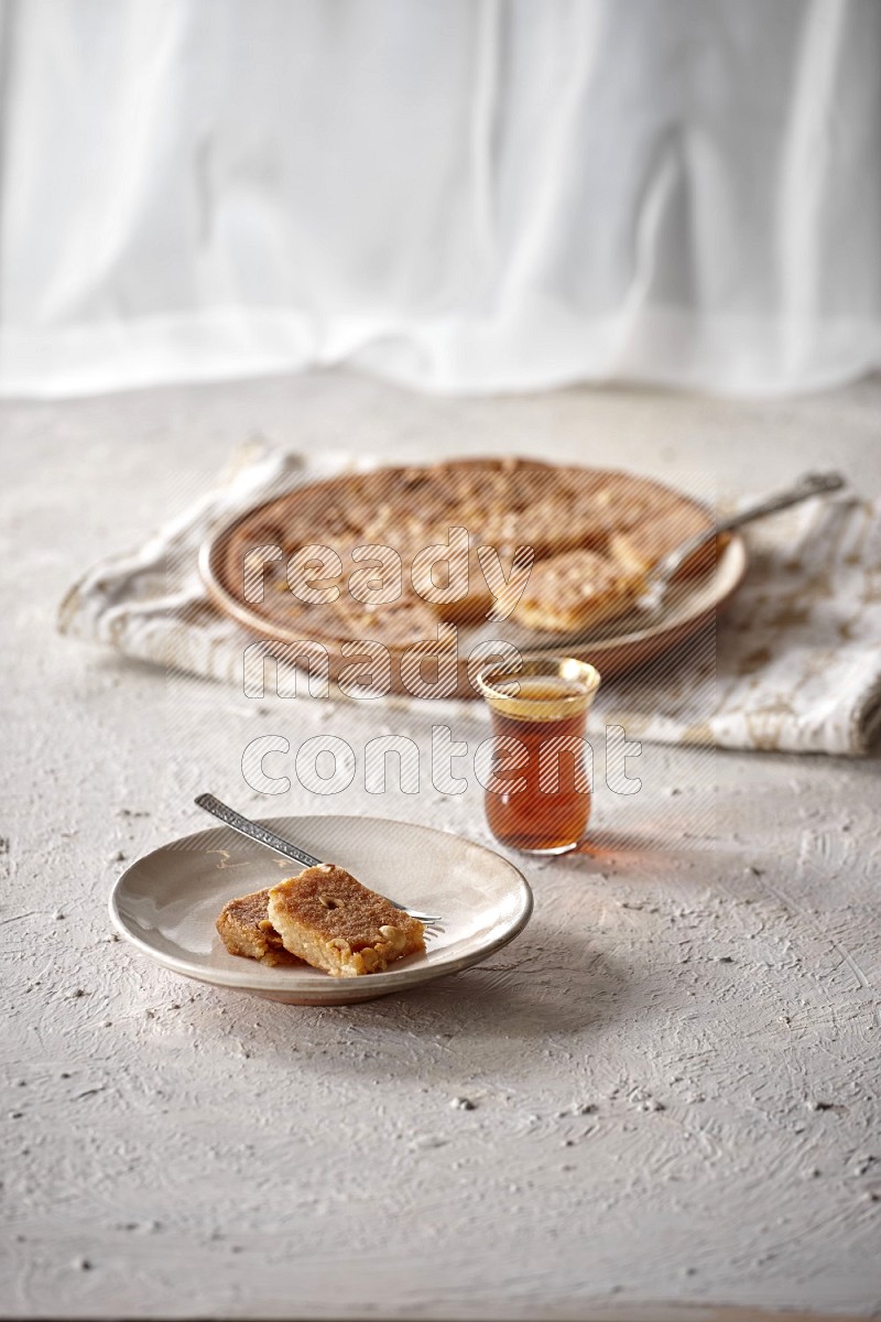 Basbousa with tea in a light setup