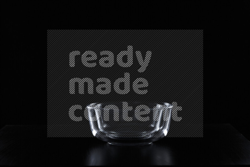 Glassware with rim light against black background