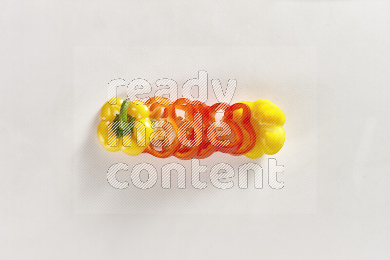 Assorted bell pepper slices on white background