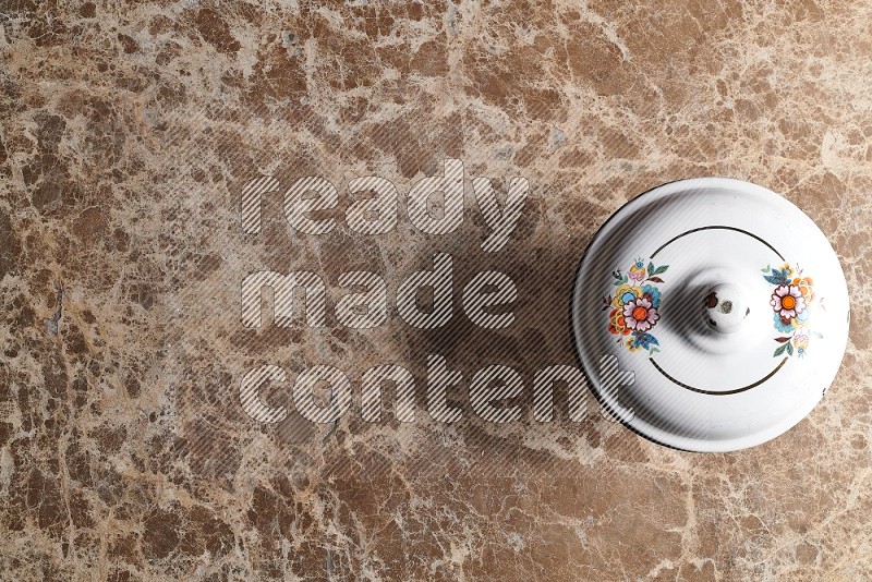 Top View Shot Of A Vintage pot On beige Marble Flooring