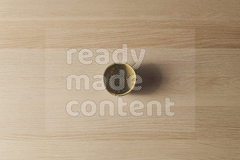 Top View Shot Of A Multicolored Pottery Cup on Oak Wooden Flooring