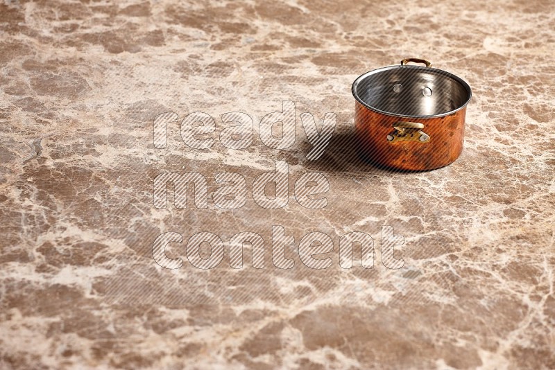 Small Copper Pot on Beige Marble Flooring, 45 degrees