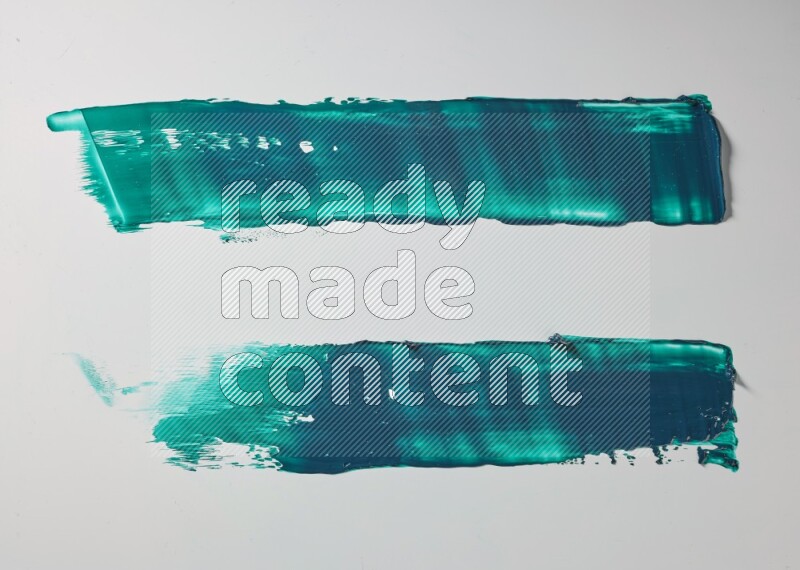Turquoise painting knife strokes on white background