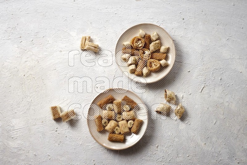 Oriental sweets in pottery plates in a light setup