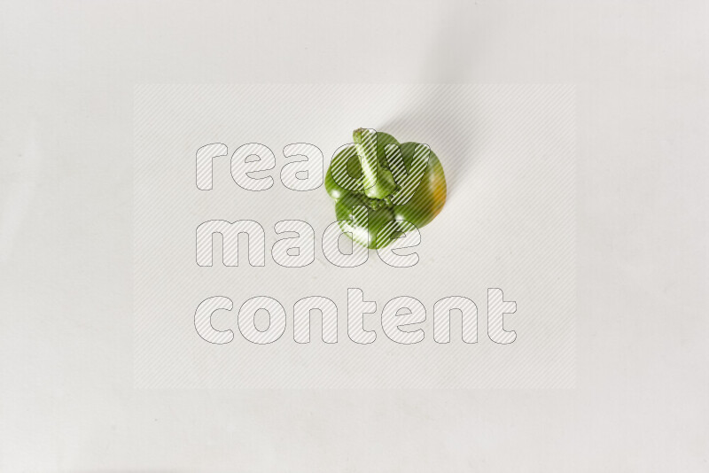 Green bell pepper slices on white background