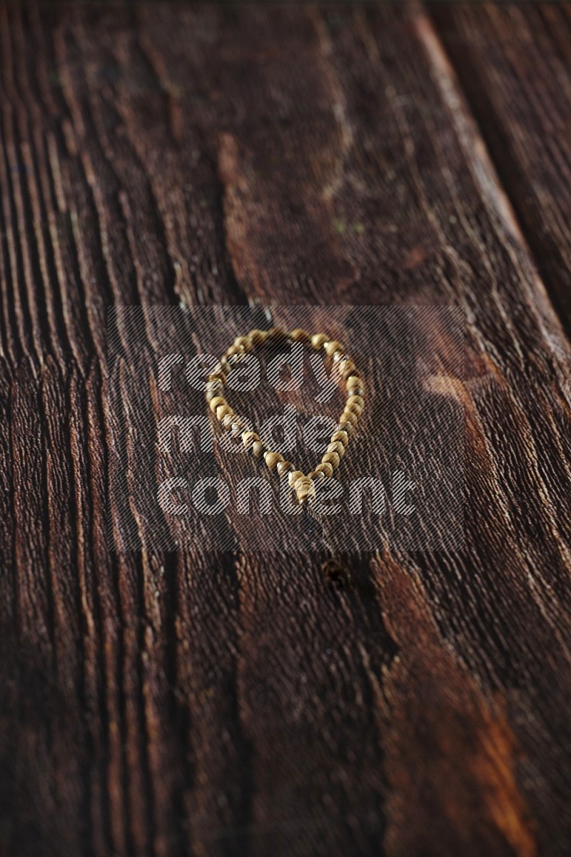 A prayer beads placed on wooden background