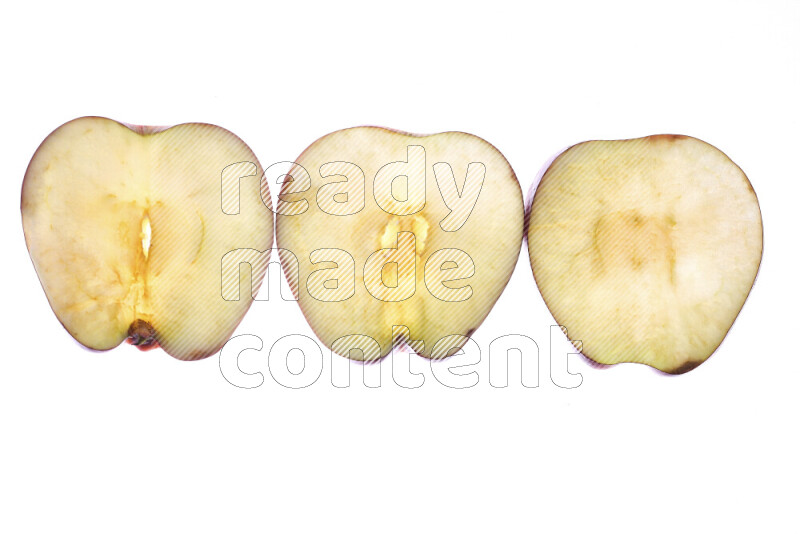 Apple slices on illuminated white background