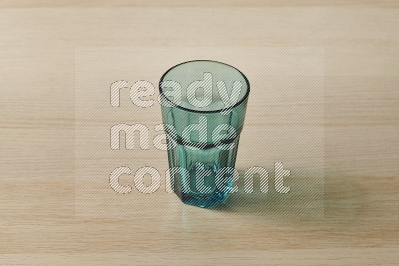 Turquoise Glass on Oak Wooden Flooring, 45 degrees