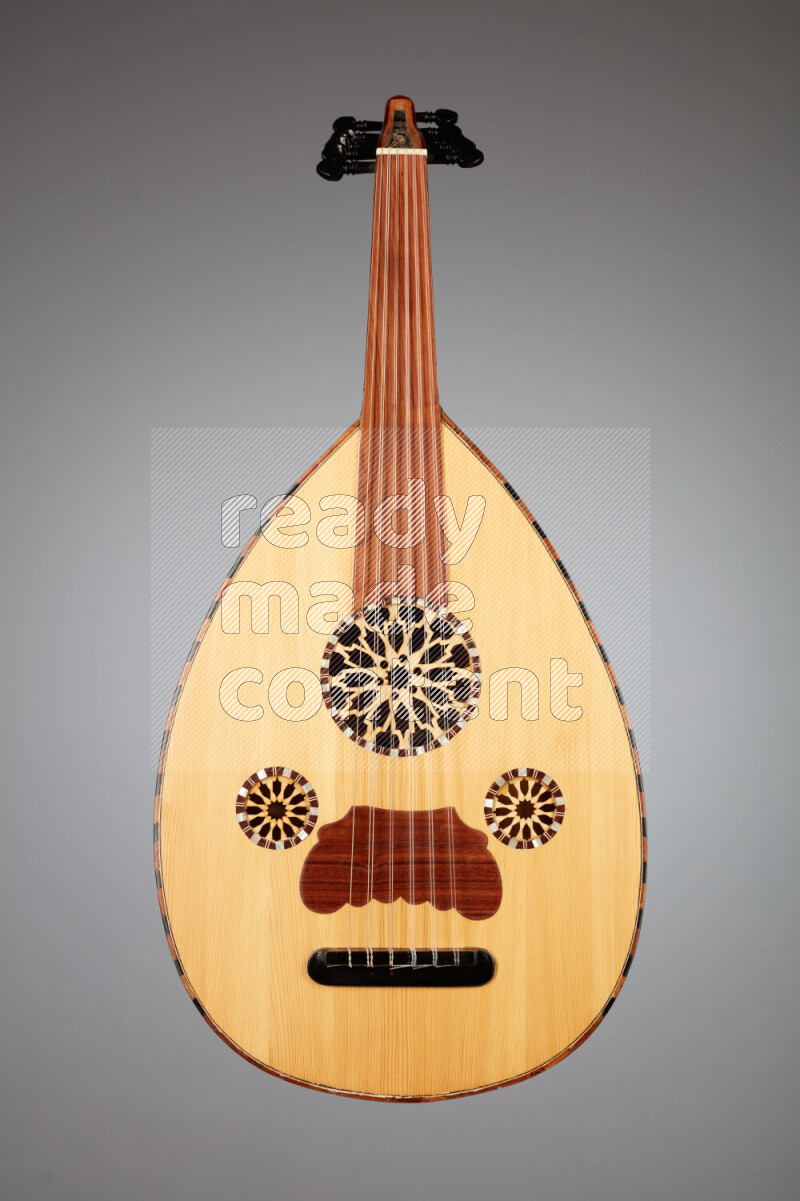 a wooden brown Oud on a gray background