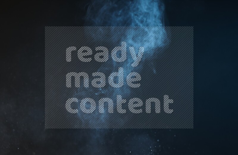 Heavy smoke in blue isolated on black background