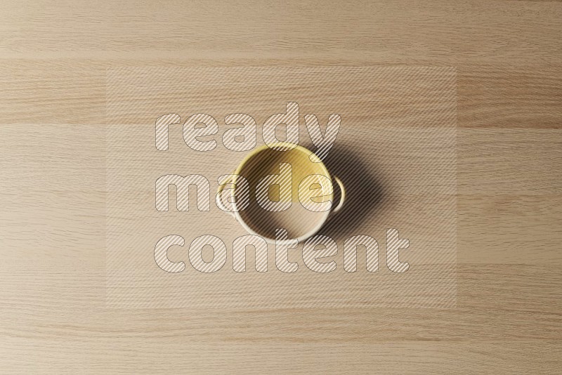 Top View Shot Of A Multicolored Pottery Oven Plate on Oak Wooden Flooring