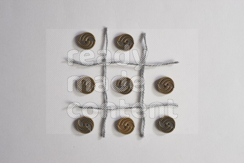 Metal buttons placed on grey background