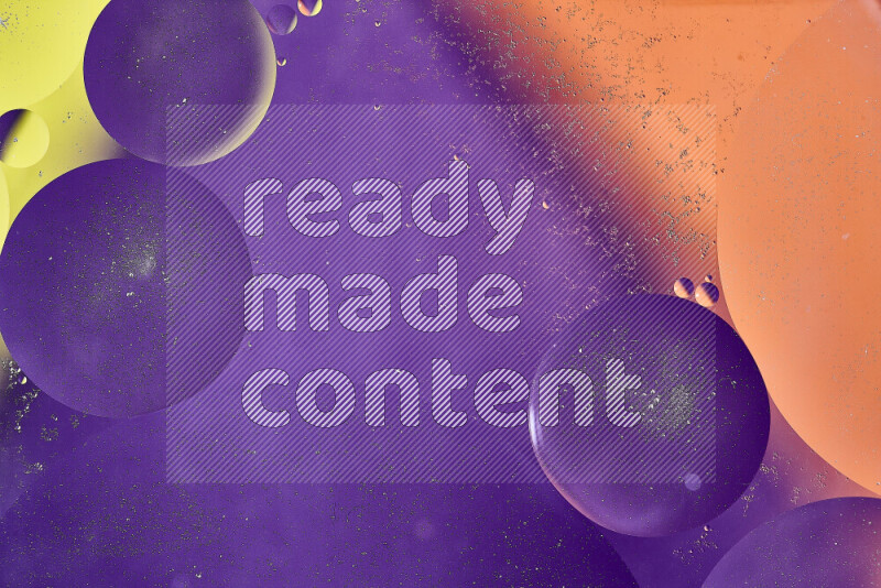 Close-ups of abstract oil bubbles on water surface in shades of yellow, orange and purple