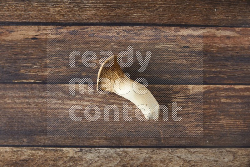 Fresh King oysters mushrooms topview on a wooden background