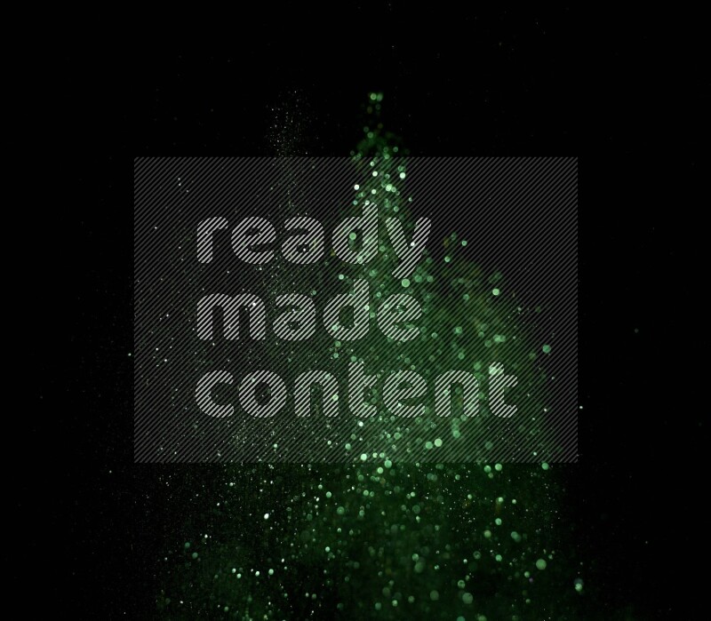 Green glitter powder isolated on black background