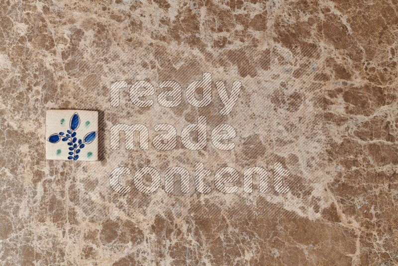 A decorative coaster on beige marble background