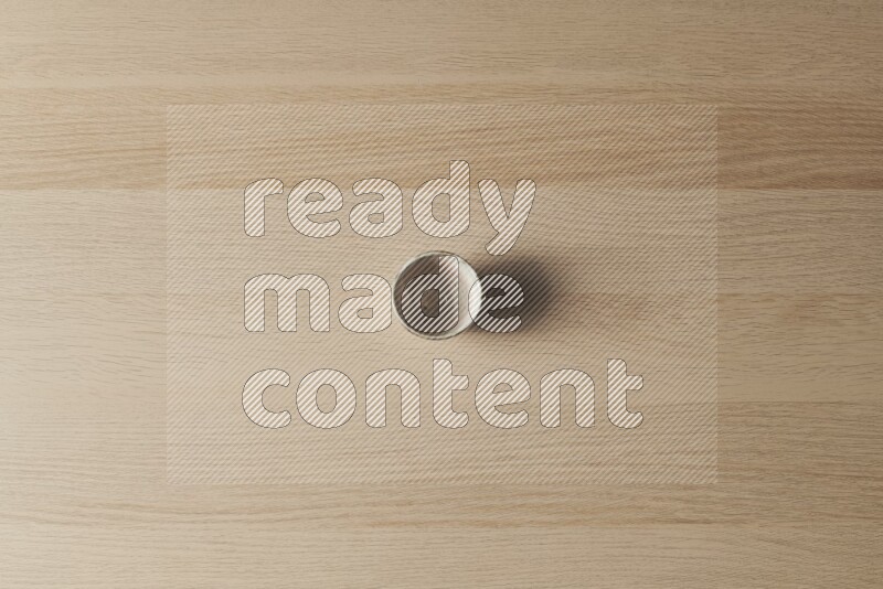 A pottery cup on light wooden background