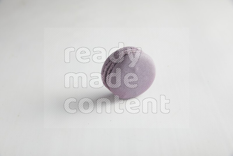 45º Shot of Purple Blueberry macaron on white background