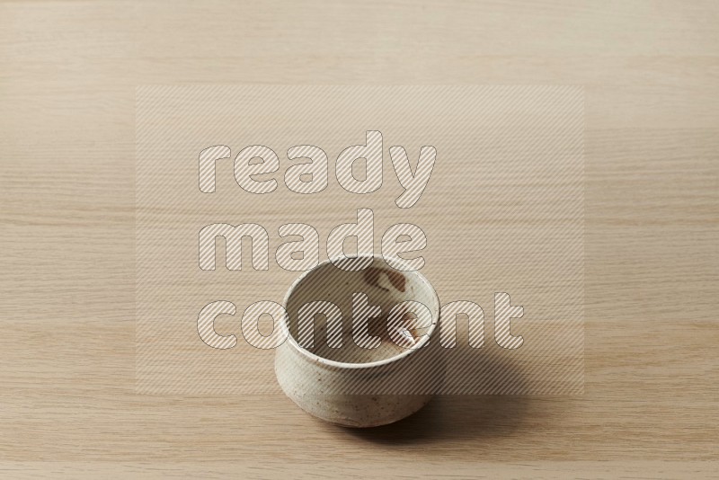 Beige Pottery Bowl on Oak Wooden Flooring, 45 degrees